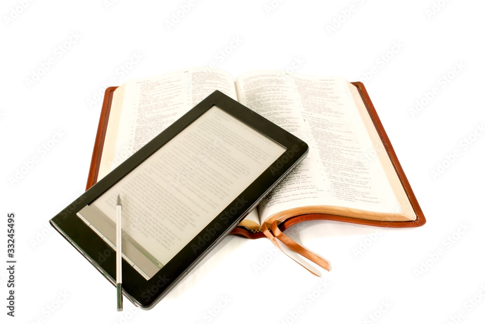 Electronic book reader laying on the Bible