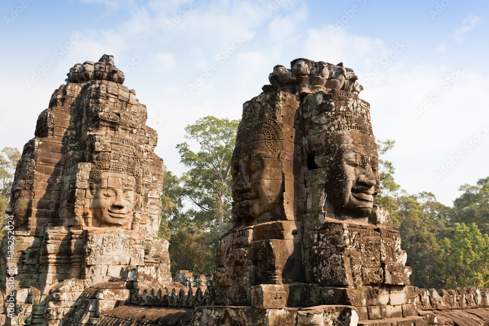 Smiling faces at Bayon Temple, Angkor, Cambodia