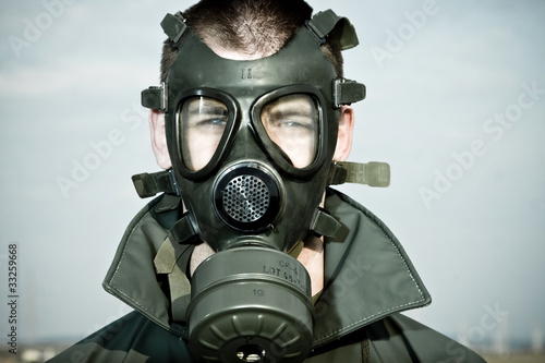 Bizarre portrait of man in gas mask