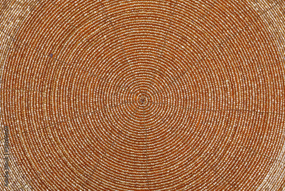 Naklejka premium Golden beadwork texture background with round lines pattern