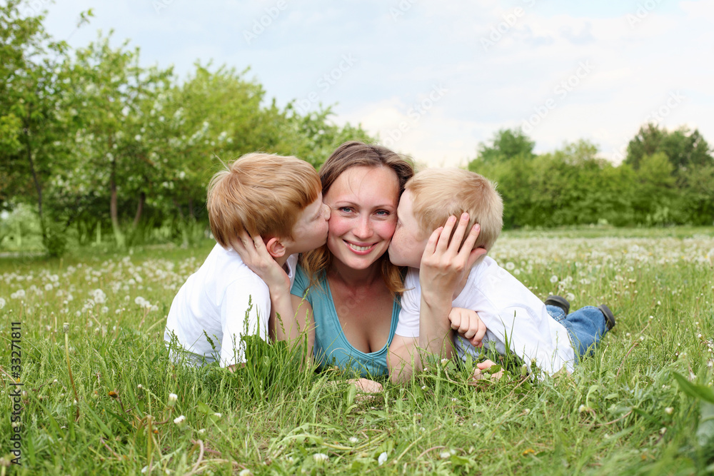 mother with her two sons outdoors mother with her two sons outdoors