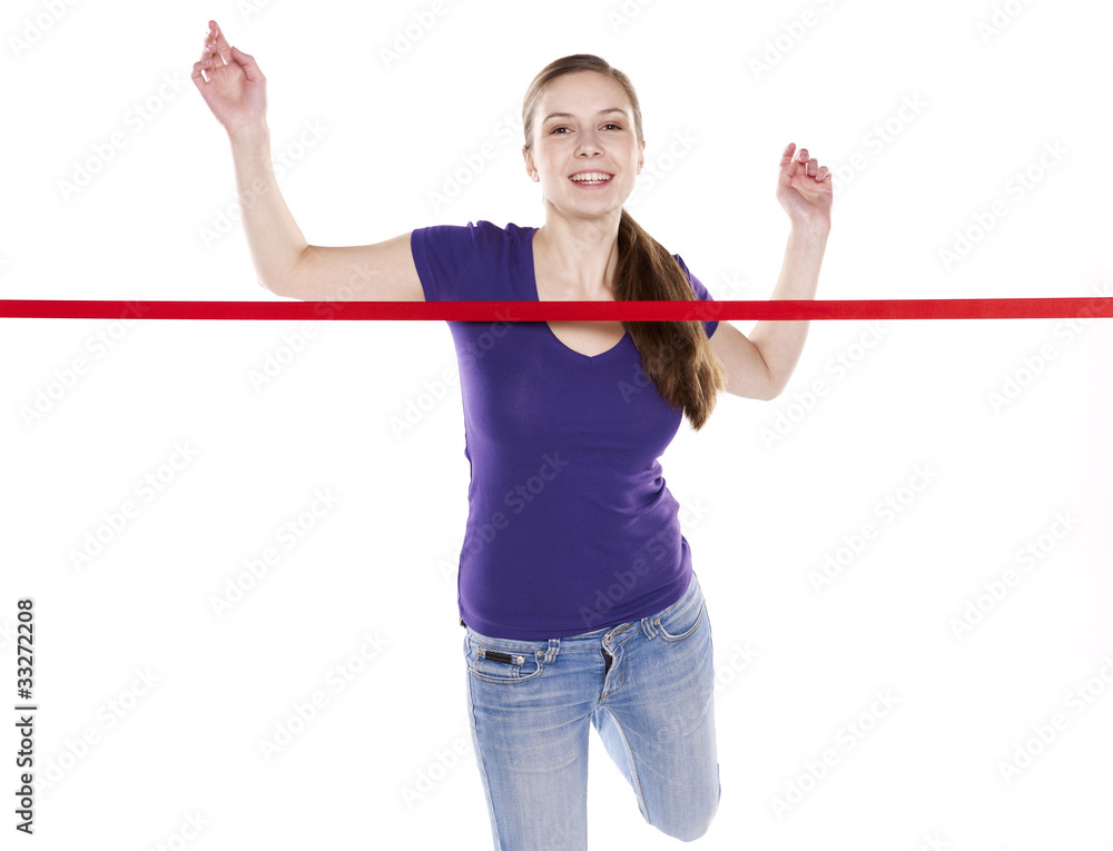 young woman running through finish line young woman running through finish line