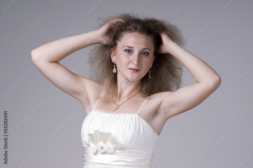 Beautiful young woman in a white dress Beautiful young woman in a white dress