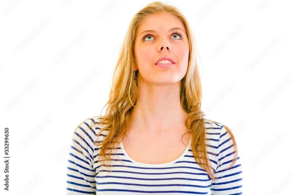 Smiling teengirl looking up at copy-space isolated on white. Smiling teengirl looking up at copy-space isolated on white.
