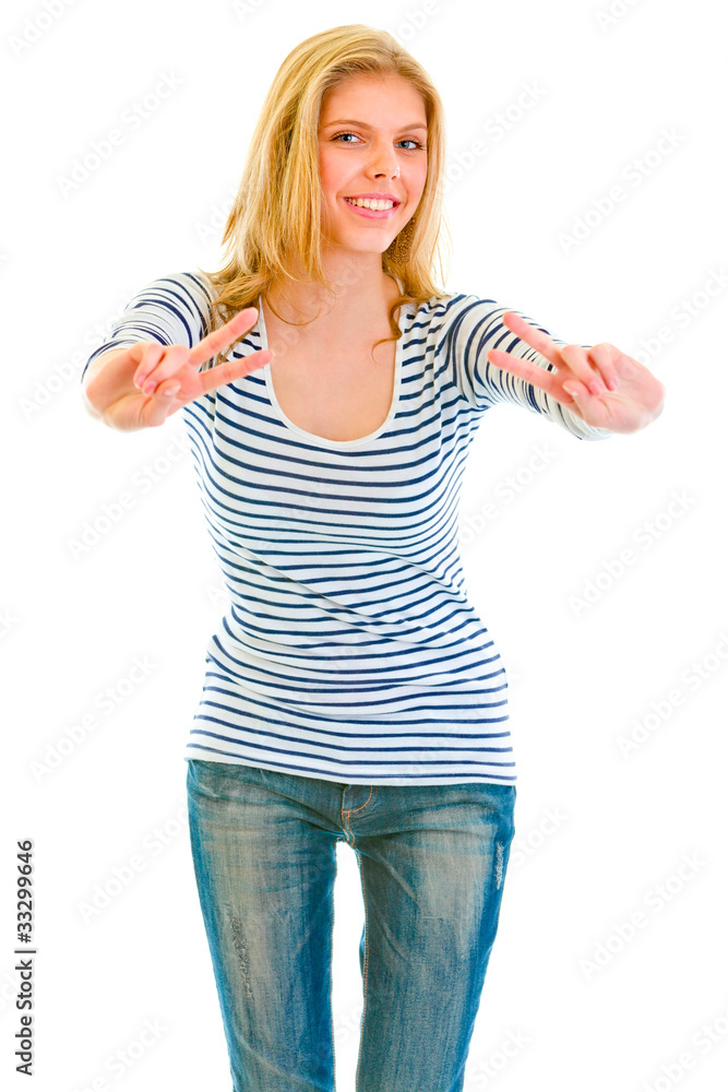 Smiling beautiful teen girl showing victory isolated on white. Smiling beautiful teen girl showing victory isolated on white.
