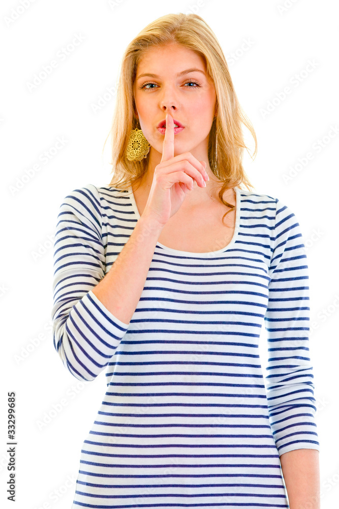 Alert beautiful teen girl with finger at mouth. Shh gesture. Alert beautiful teen girl with finger at mouth. Shh gesture.