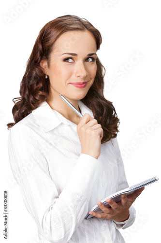 Happy young business woman with notepad writing, isolated