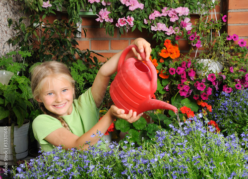 Girl pouring flowers photo