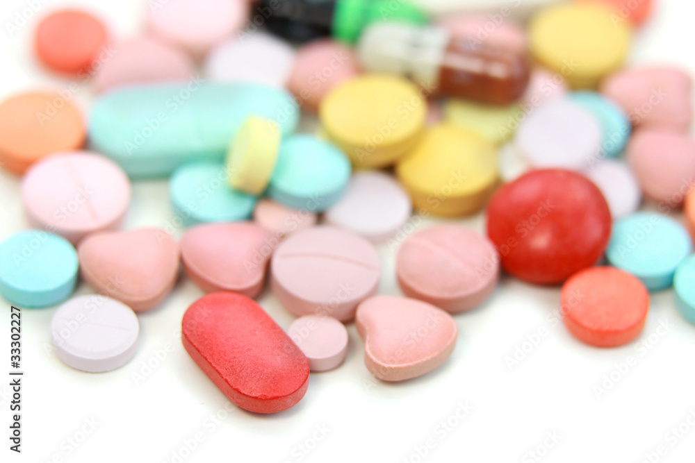 colorful medicated pills on white background colorful medicated pills on white background