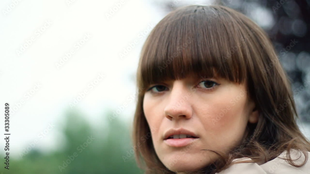 Portrait of sad young woman outdoor, slow motion Portrait of sad young woman outdoor, slow motion