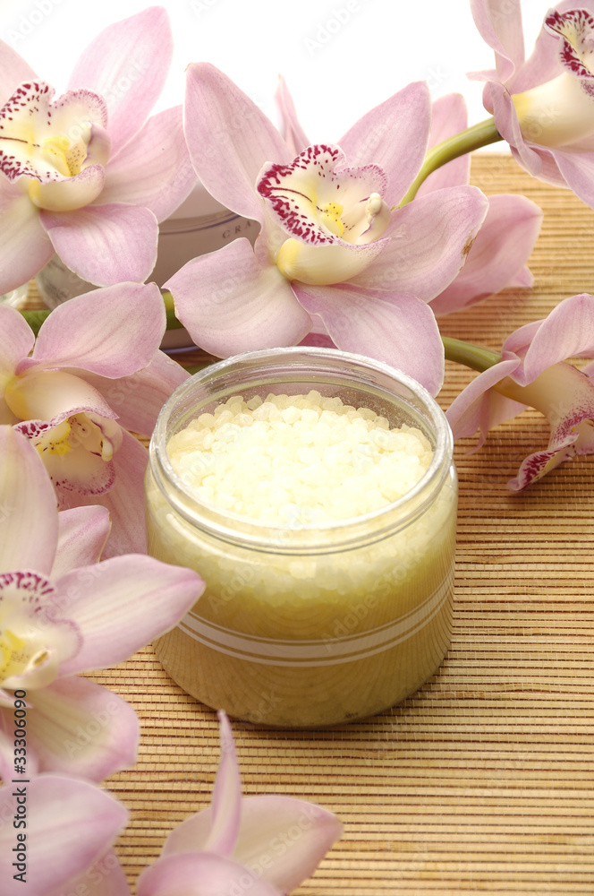 bowl of salt and pink orchids on mat bowl of salt and pink orchids on mat