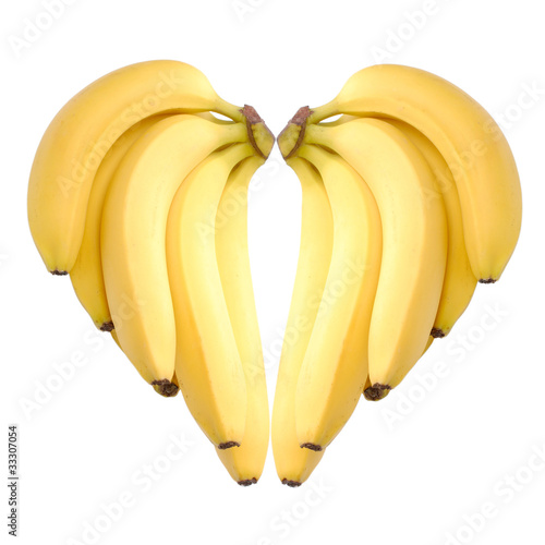 ripe bananas heart isolated on white
