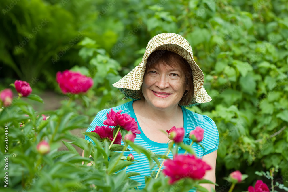 Happy mature woman in  garden