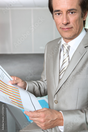 businessman reading charts