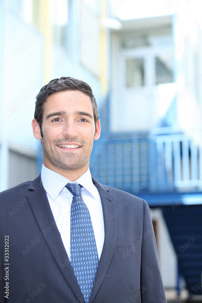 Smiling entrepreneur on a site Smiling entrepreneur on a site