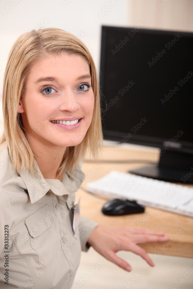 Young woman in front of desktop computer Young woman in front of desktop computer