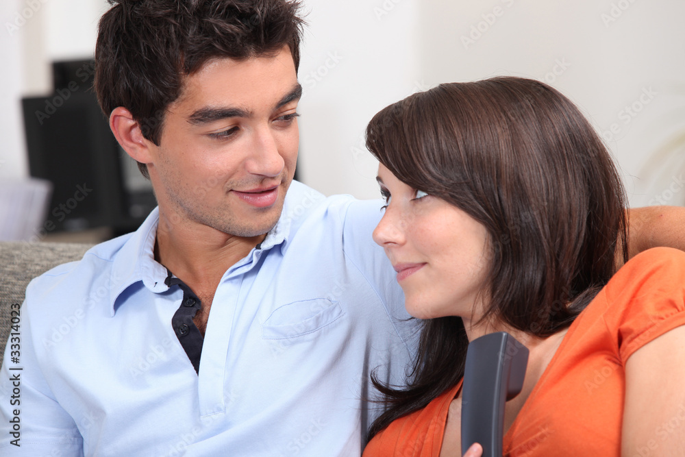 Couple taking an unexpected phone call Couple taking an unexpected phone call