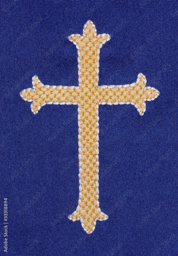 Embroidered gold cross on blue velvet