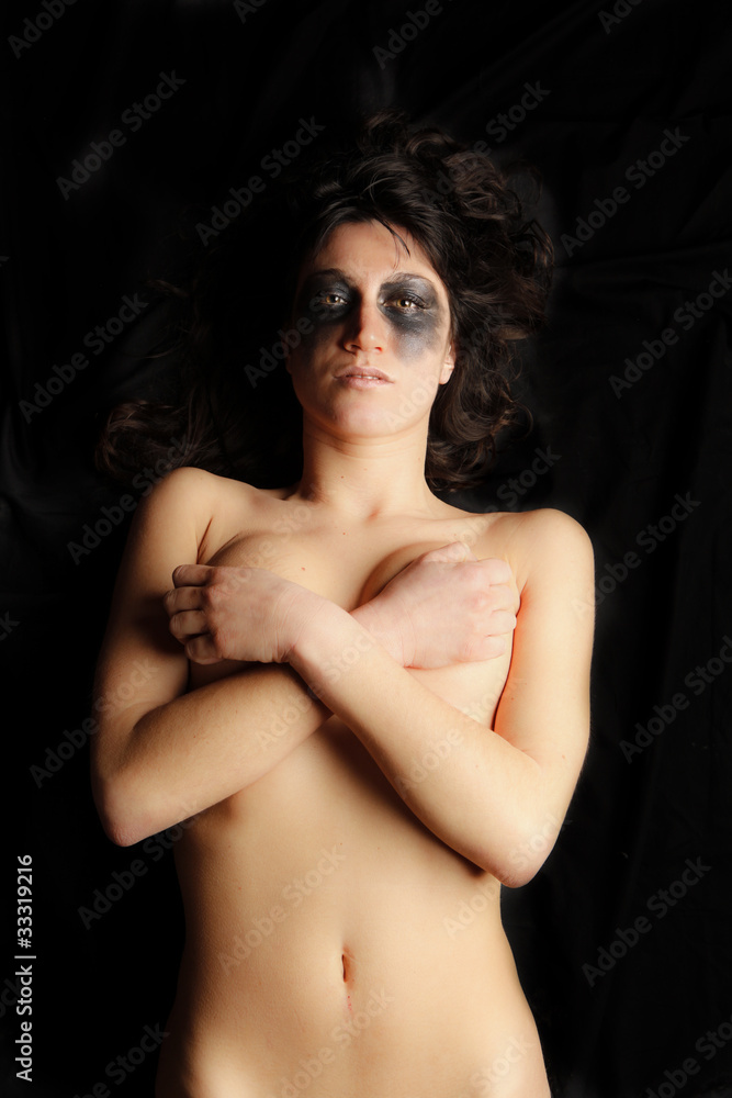 Naklejka premium girl's portrait with black make up on black background