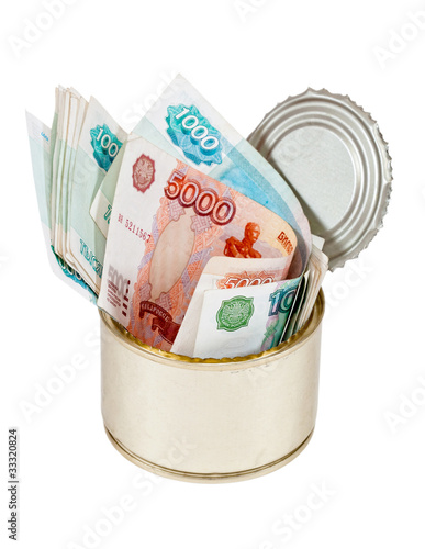 Russian roubles  bills  in  tin can over white background photo