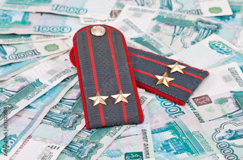 Shoulder strap of russian police on money background photo