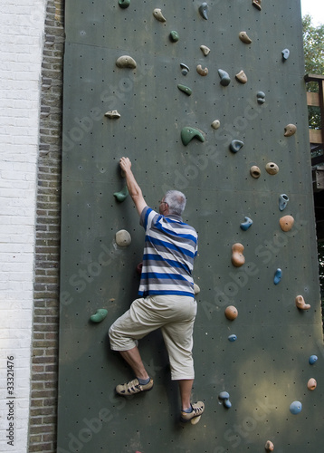 man and wall climbing