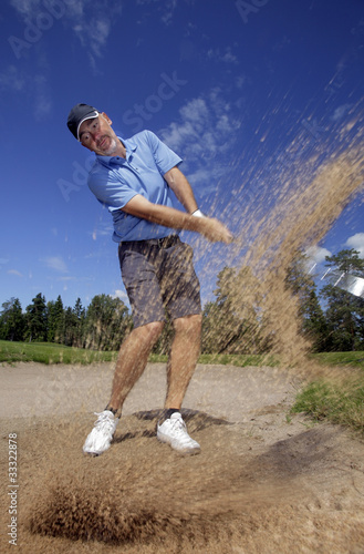 golfer shooting a golf ball © Mikael Damkier