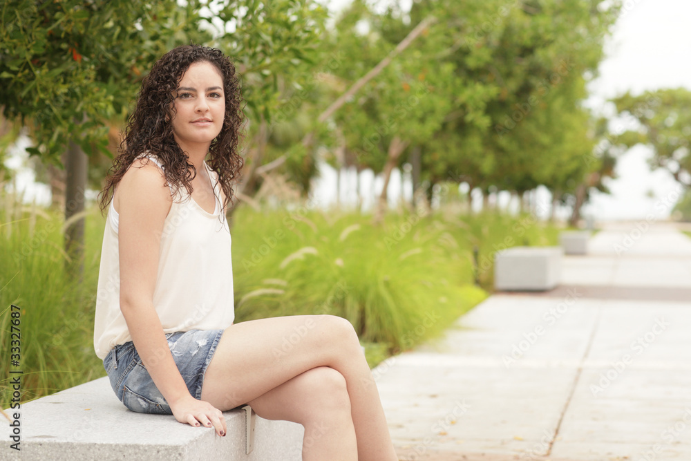 Woman sitting with legs crossed Woman sitting with legs crossed