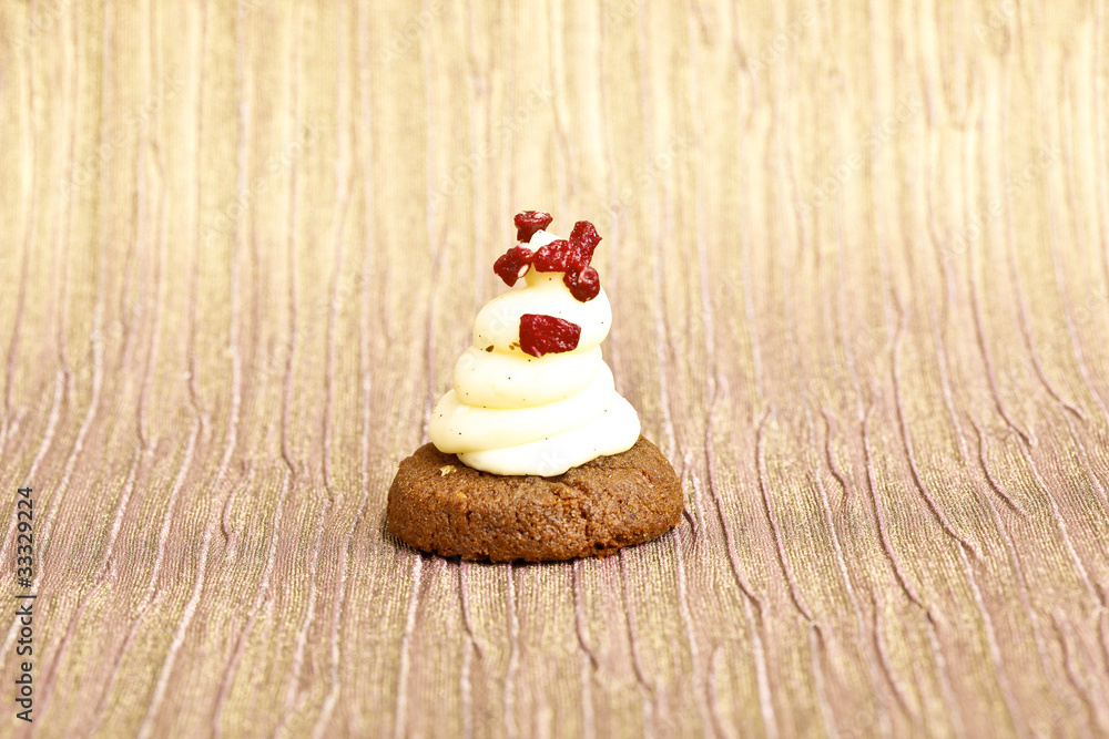 Beautiful little cake on colorful wallpaper background Beautiful little cake on colorful wallpaper background
