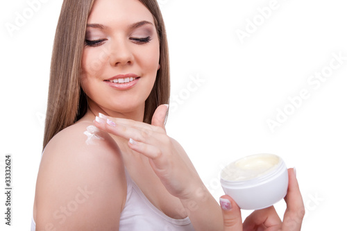 Fototapeta Naklejka Na Ścianę i Meble -  woman applying cream on her body