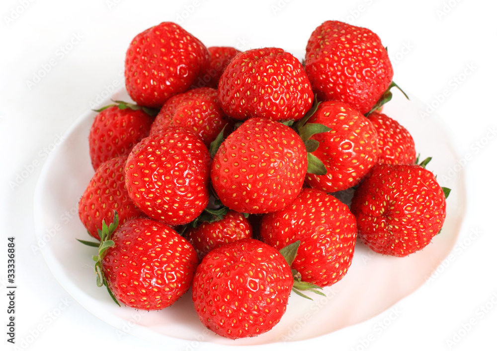 A lot of strawberry lies on a plate A lot of strawberry lies on a plate