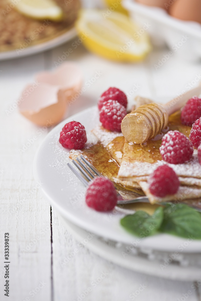 Freshly prepared crepes with raspberries Freshly prepared crepes with raspberries