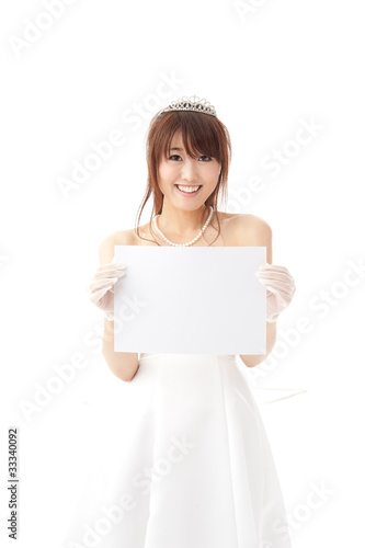 beautiful asian bride holding a blank whiteboard