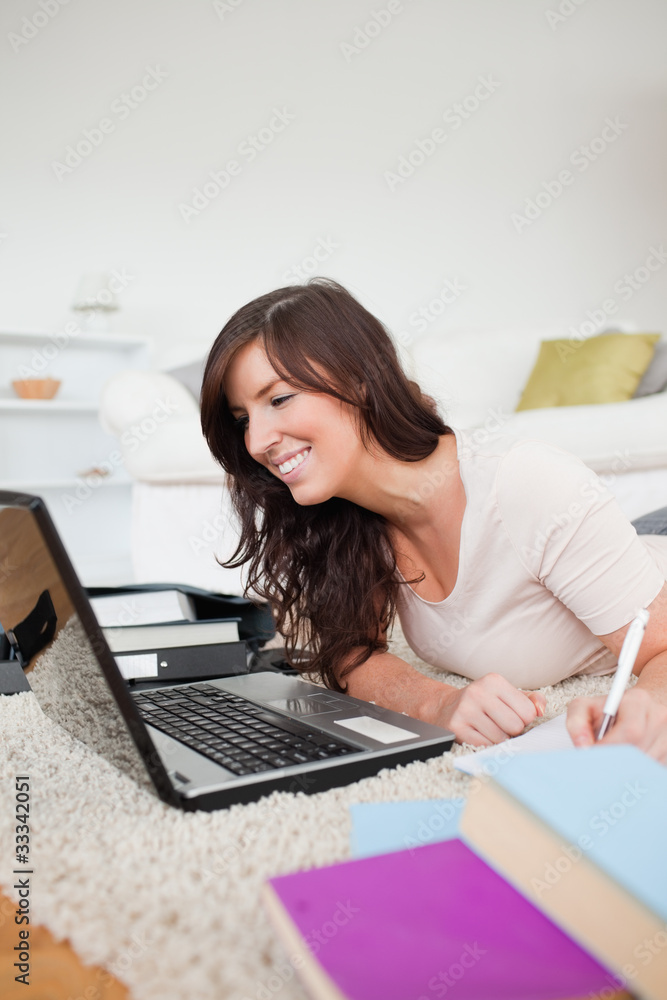 Young beautiful woman relaxing with her laptop and posing while Young beautiful woman relaxing with her laptop and posing while