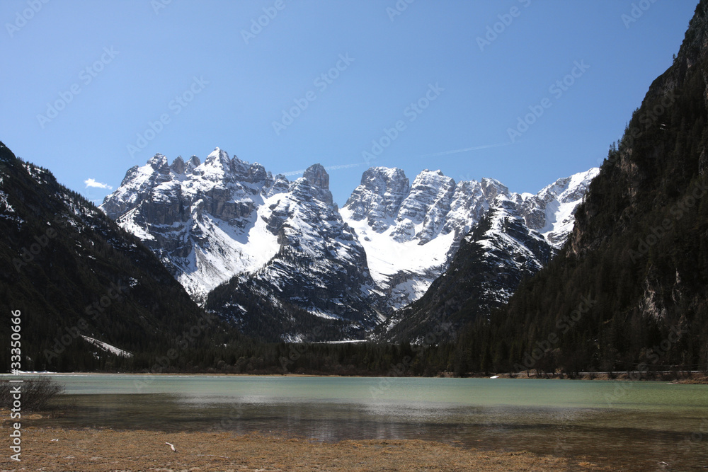 large mountain lake with snowed mountains, italy dolomites. large mountain lake with snowed mountains, italy dolomites.