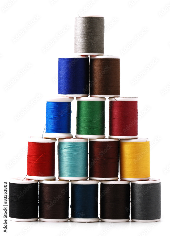 Spools of colour threads isolated on white