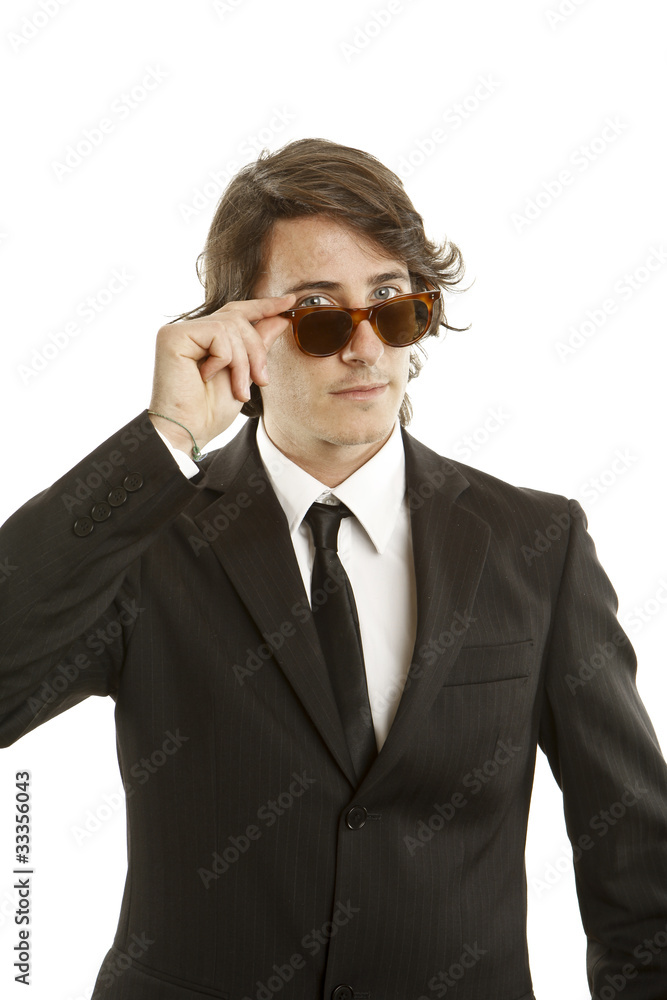 attractive young man wearing elegant black suit and sunglasses attractive young man wearing elegant black suit and sunglasses