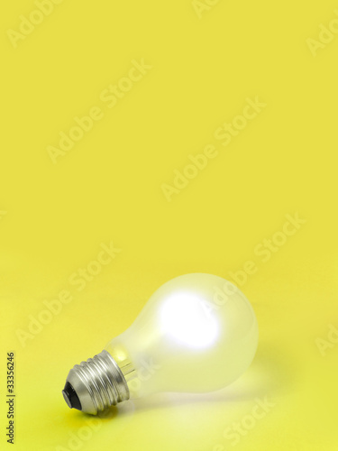 Lighting bulb on yellow background