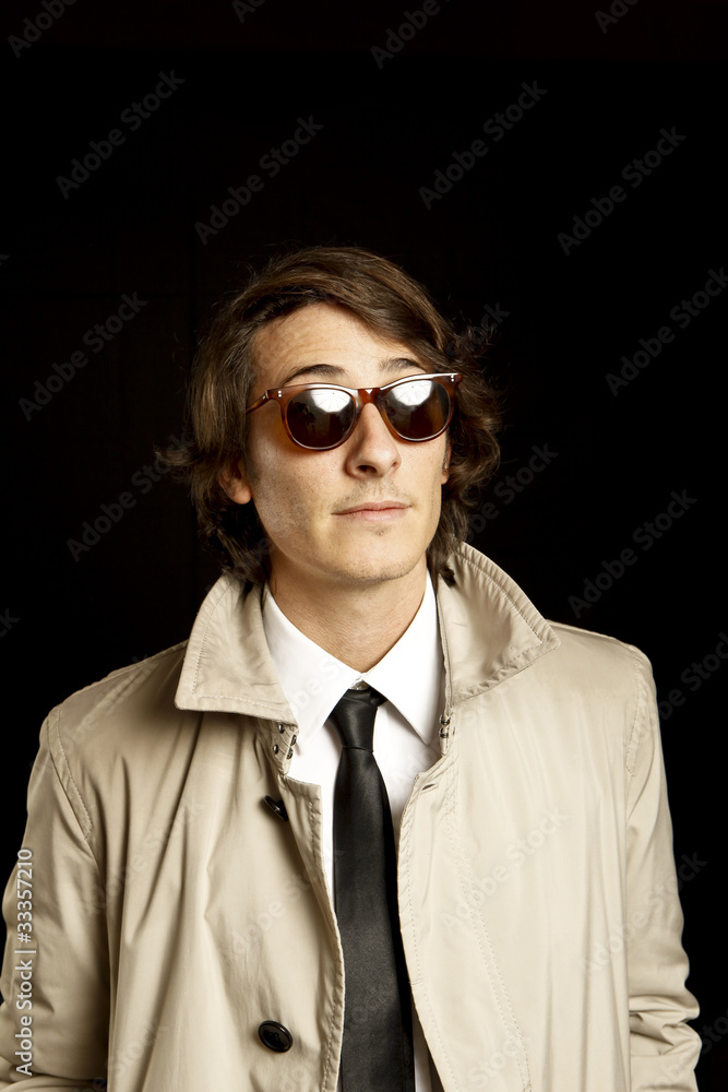 fashion young man with sunglasses and trenchcoat fashion young man with sunglasses and trenchcoat