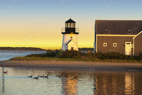Hyannis harbor lighthouse at sunset photo