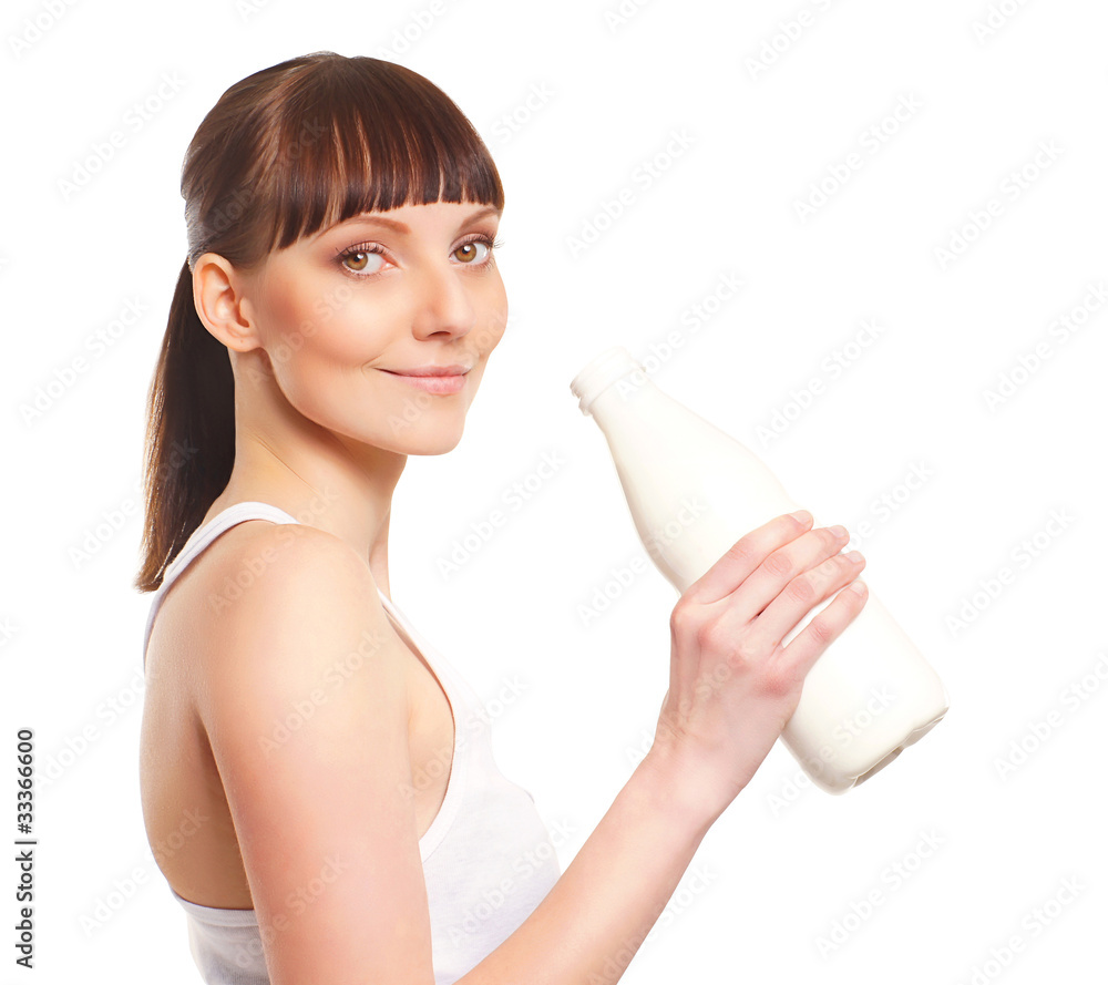 A young and healthy Caucasian woman drinking fresh milk A young and healthy Caucasian woman drinking fresh milk