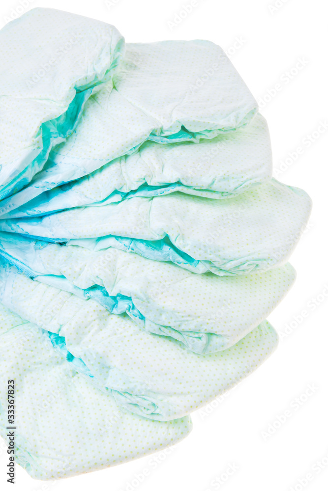 Used disposable baby diapers isolated over white background.