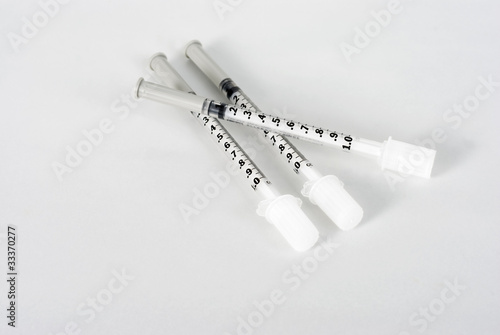 Three allergy syringes on a white background