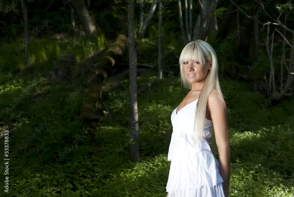 girl standing in a dark forest girl standing in a dark forest