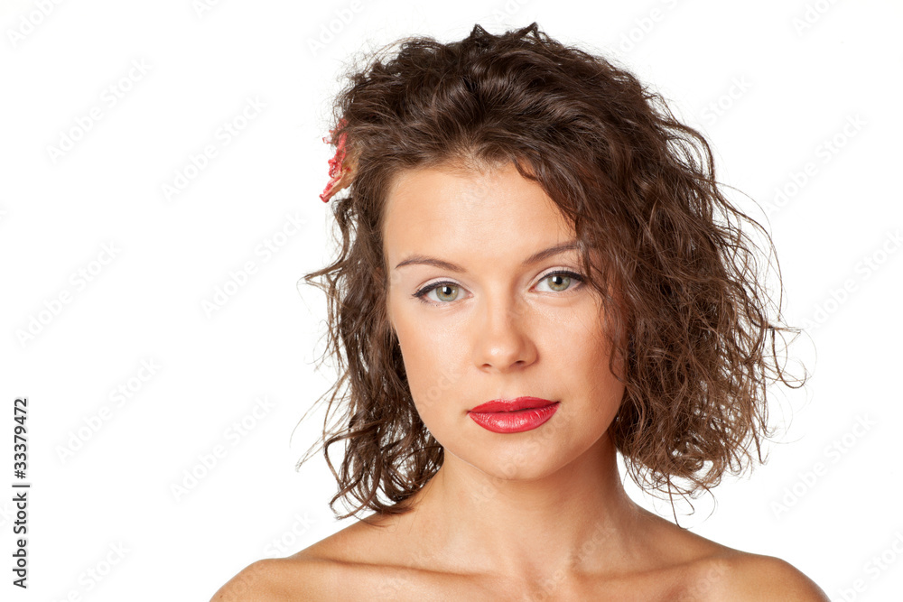 Closeup portrait of young beautiful female with flower in hair Closeup portrait of young beautiful female with flower in hair