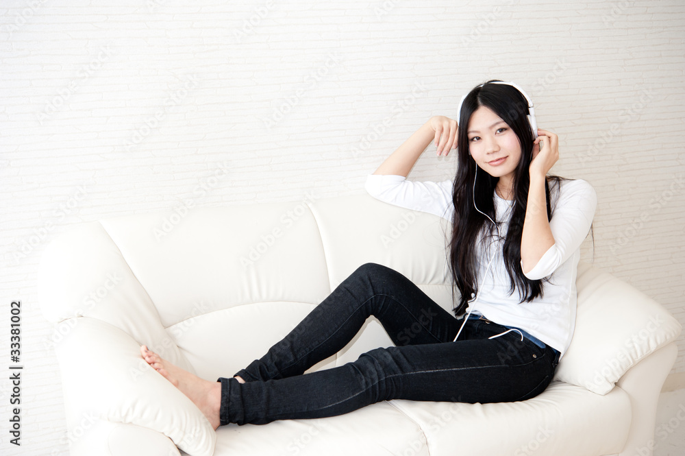 beautiful asian woman relaxing on the couch