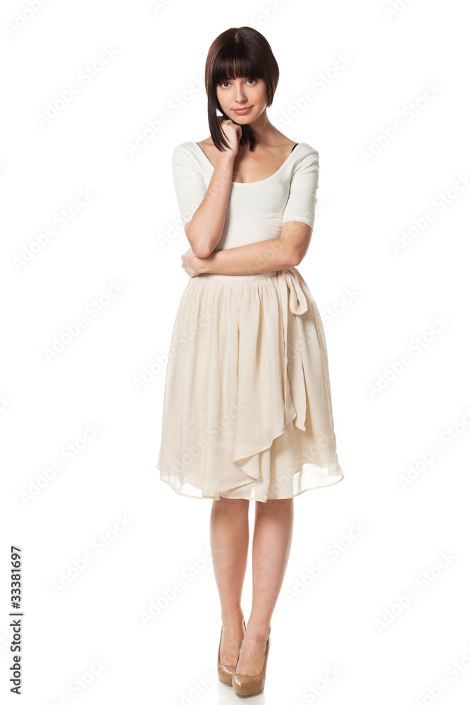 Full-body portrait of young elegant female in summer dress