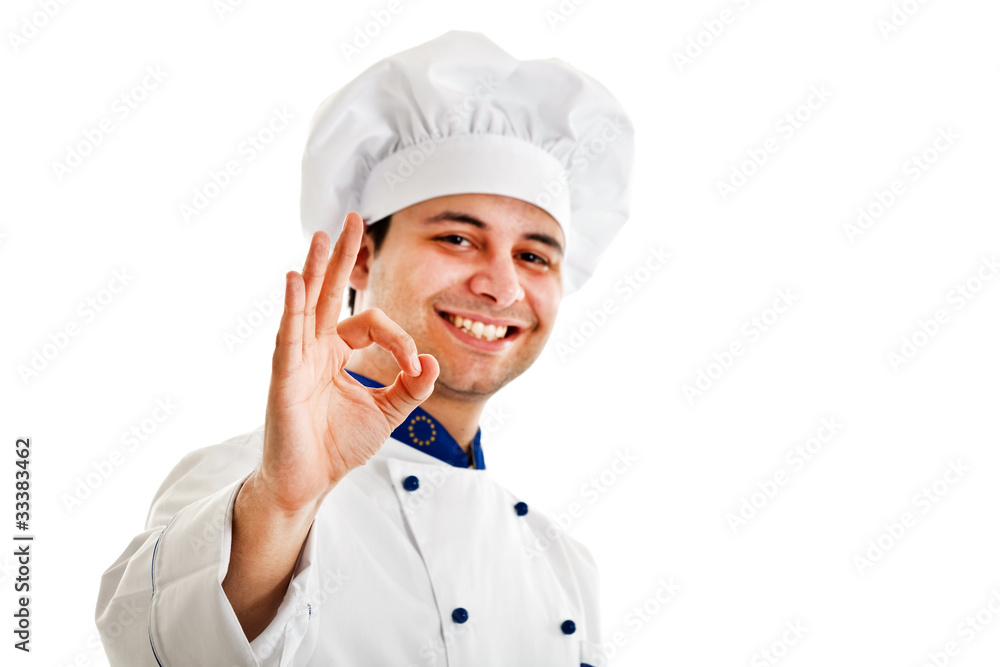 Smiling chef isolated on white showing ok hand sign Smiling chef isolated on white showing ok hand sign