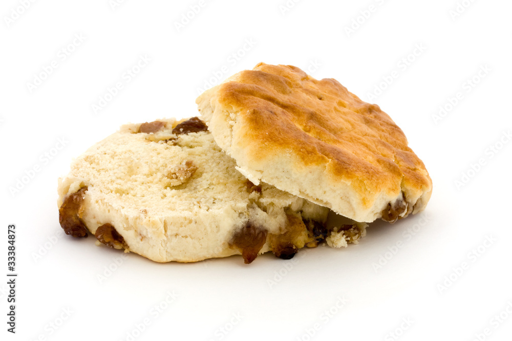 Sliced fruit scone over white Sliced fruit scone over white