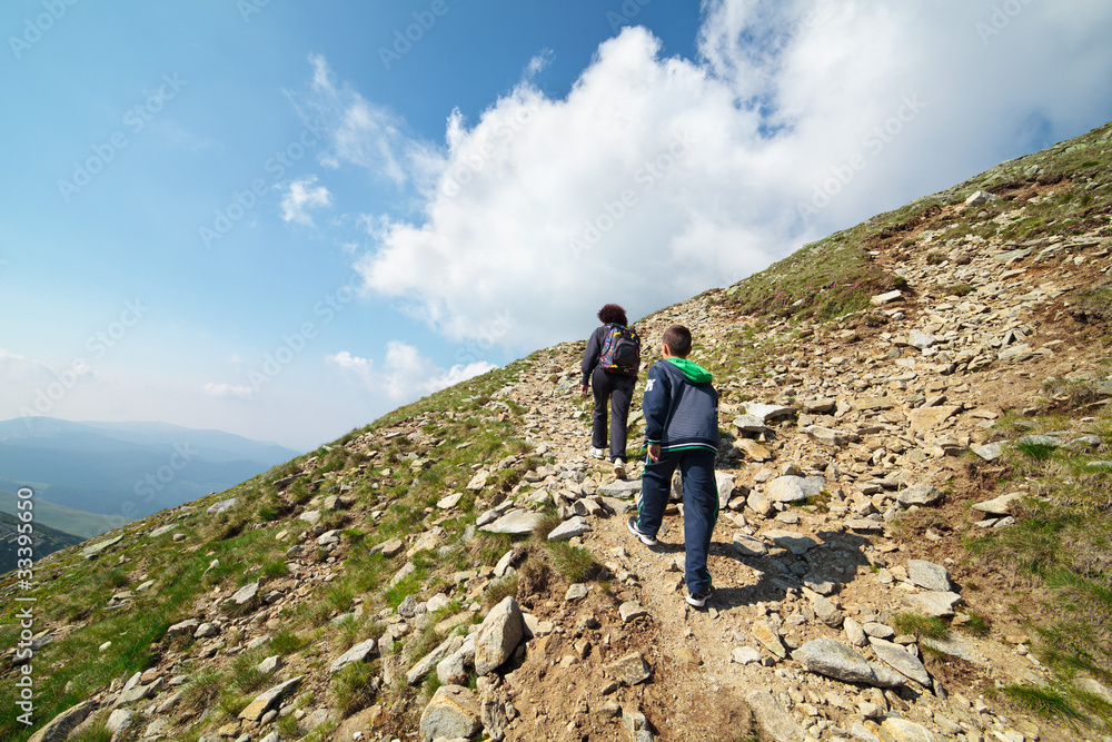 Tourists hiking on Iezer peak in Parang mountains, Romania